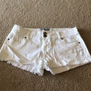 Distressed white shorts